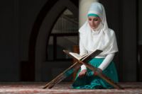 muslim-woman-reading-koran-holy-islamic-book-45244705